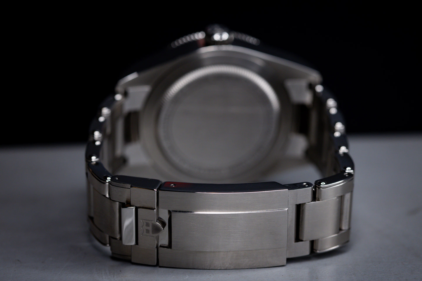 Tudor Black Bay 58 GMT Coke watch back view showing stainless steel bracelet and case details.