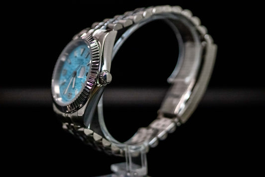 Ice Blue Seiko Mod Land Dweller watch with frosted metallic dial, side view showing brushed stainless steel case.