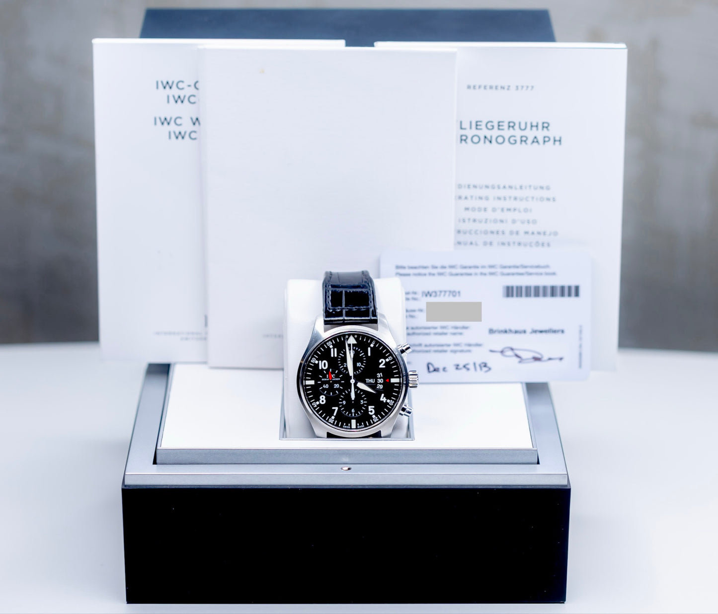 IWC Pilots Watch Chronograph with original box and papers displayed elegantly.