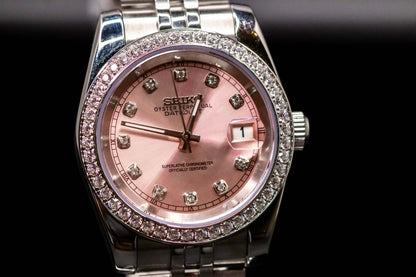 Pink Diamond Bezel Seikomod DateJust watch featuring a pink dial and diamond markers, luxury timepiece by Custom Seiko Mods.