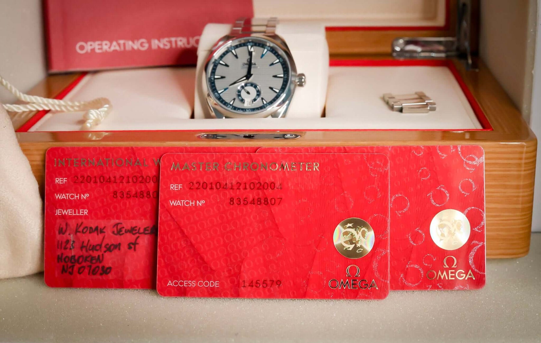 Omega Seamaster Aqua Terra 41mm Silver Dial – Ref. 220.10.41.21.02.004 and warranty cards in display case.