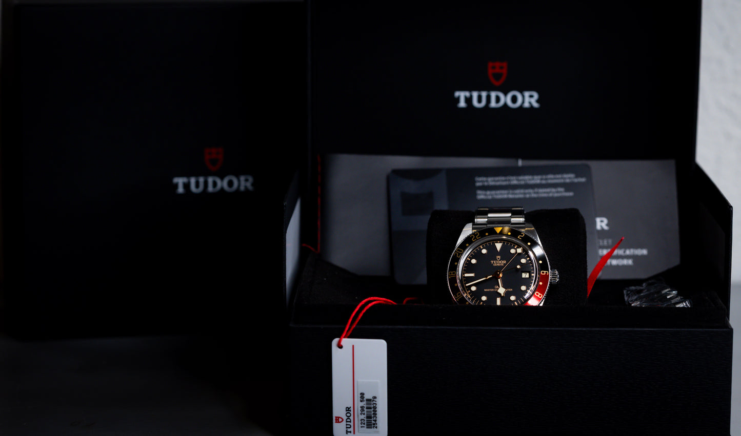 Tudor Black Bay 58 GMT Coke watch displayed in its box with warranty and manual.