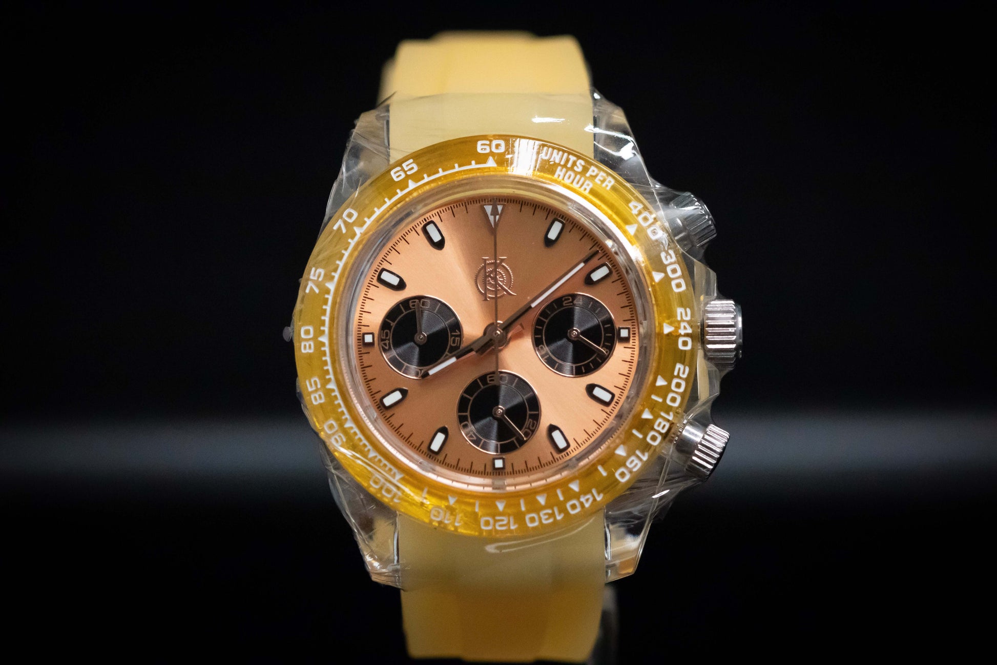 KWC Orange Ceramic Chronograph watch with yellow rubber strap and brown dial, featuring meca-quartz movement.