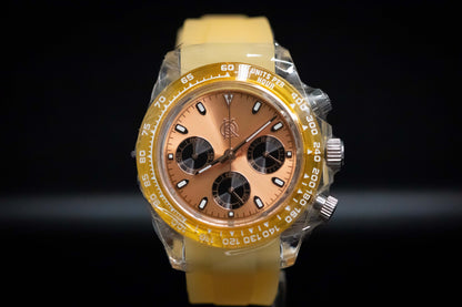 KWC Orange Ceramic Chronograph watch with yellow rubber strap and brown dial, featuring meca-quartz movement.
