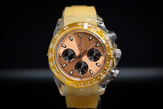 KWC Orange Ceramic Chronograph watch with yellow rubber strap and brown dial, featuring meca-quartz movement.
