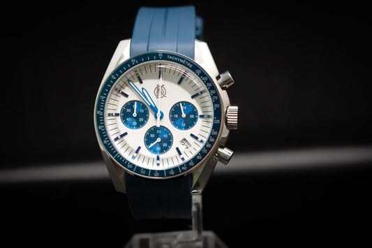 KWC Snoopy Chronograph watch with white dial and blue accents, featuring a rubber strap and stainless steel case.