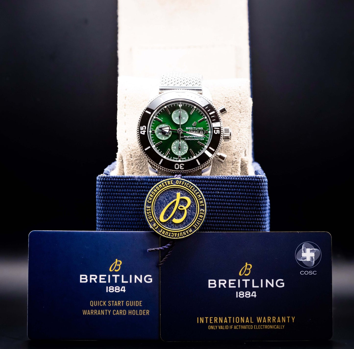 2025 BNIB - Breitling SuperOcean Chronograph Green 44mm- Breitling A13313 displayed with warranty cards.