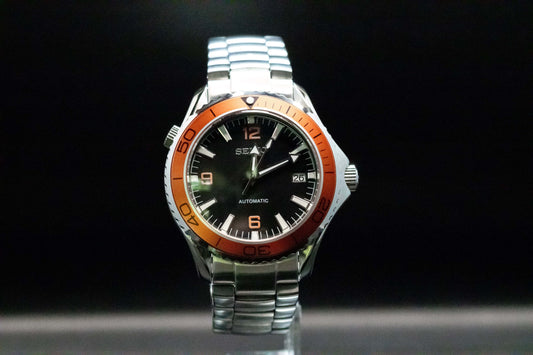 Seikomod Tiger Seamaster Automatic Watch with black dial and orange bezel, set in a polished stainless steel frame.
