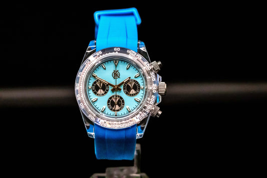 KWC Blue Ceramic Chronograph watch with turquoise dial and blue rubber strap, featuring classic chronograph functions.