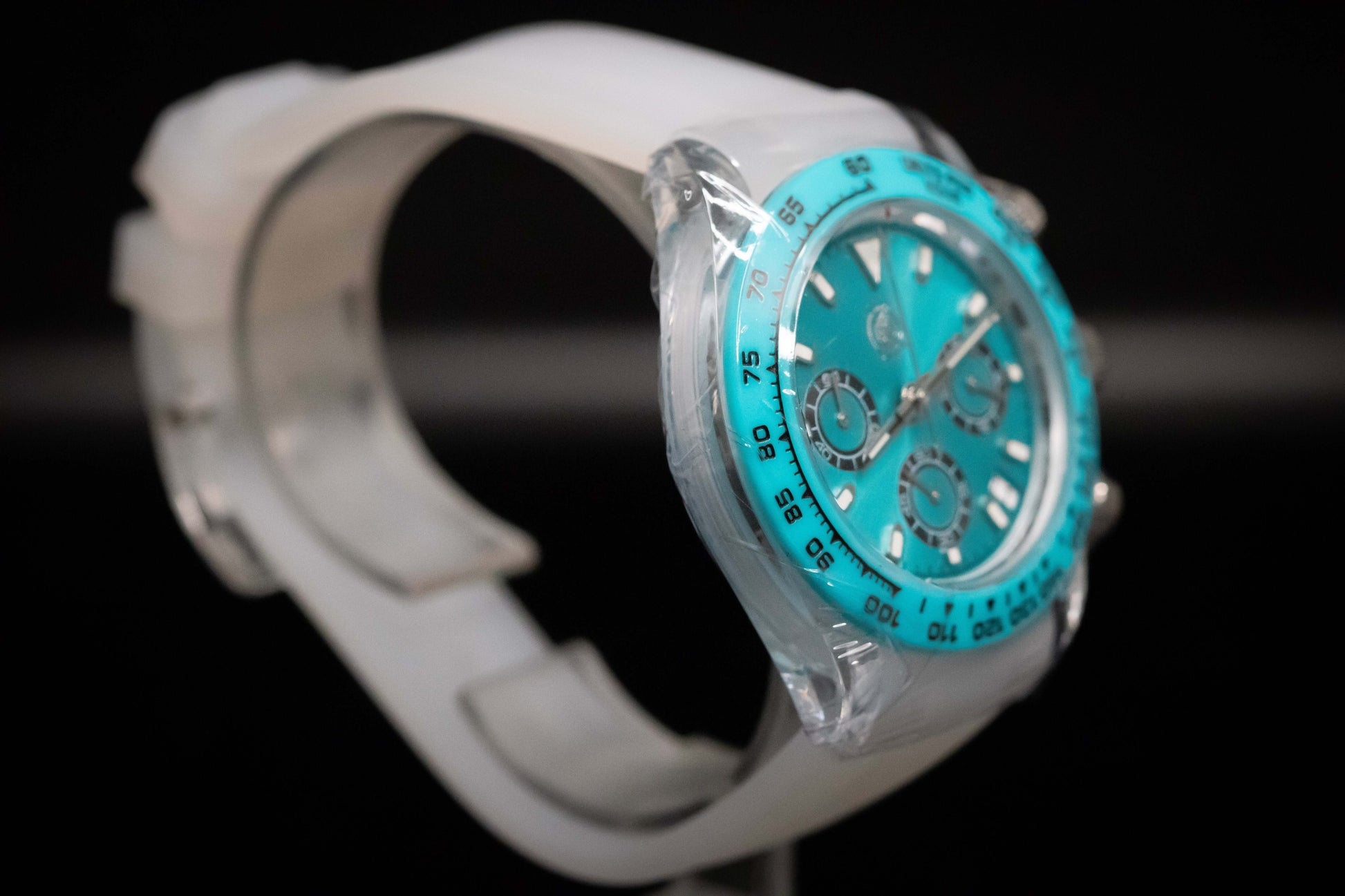 KWC Ice Ceramic Chronograph with turquoise dial and white strap, showcasing modern design and rugged utility.