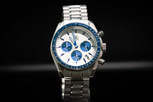 KWC Snoopy Chronograph watch with white dial and blue accents, featured in a stainless steel case.
