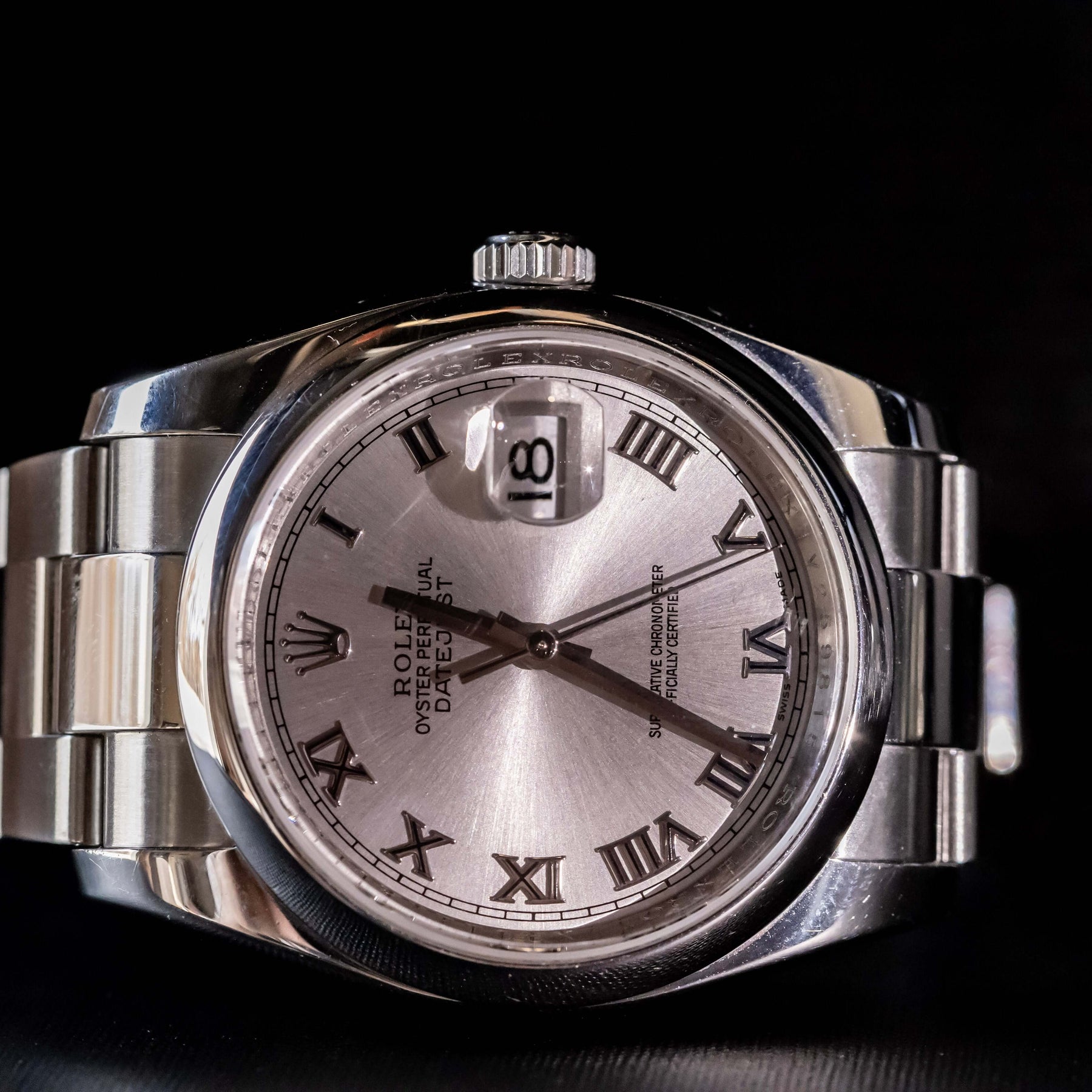 Rolex Datejust 36 full set with silver dial and Roman numerals, stainless steel case and bracelet, elegant design.