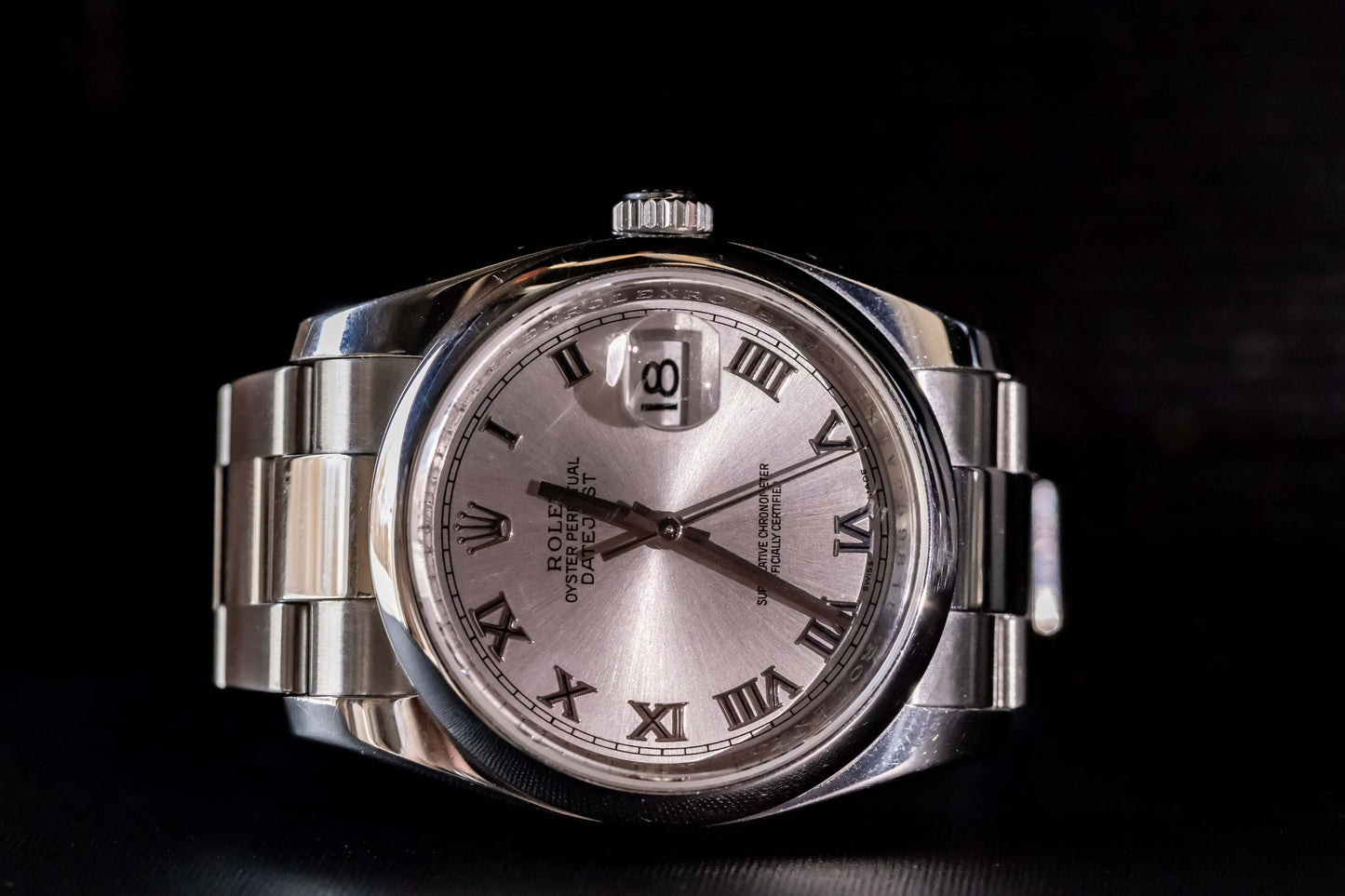 Rolex Datejust 36 full set with silver dial and Roman numerals, stainless steel case and bracelet, elegant design.