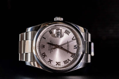 Rolex Datejust 36 full set with silver dial and Roman numerals, stainless steel case and bracelet, elegant design.