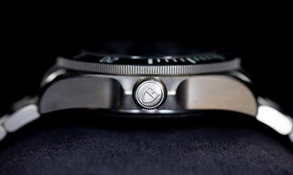 Tudor Pelagos dive watch close-up showcasing the crown and titanium case design.