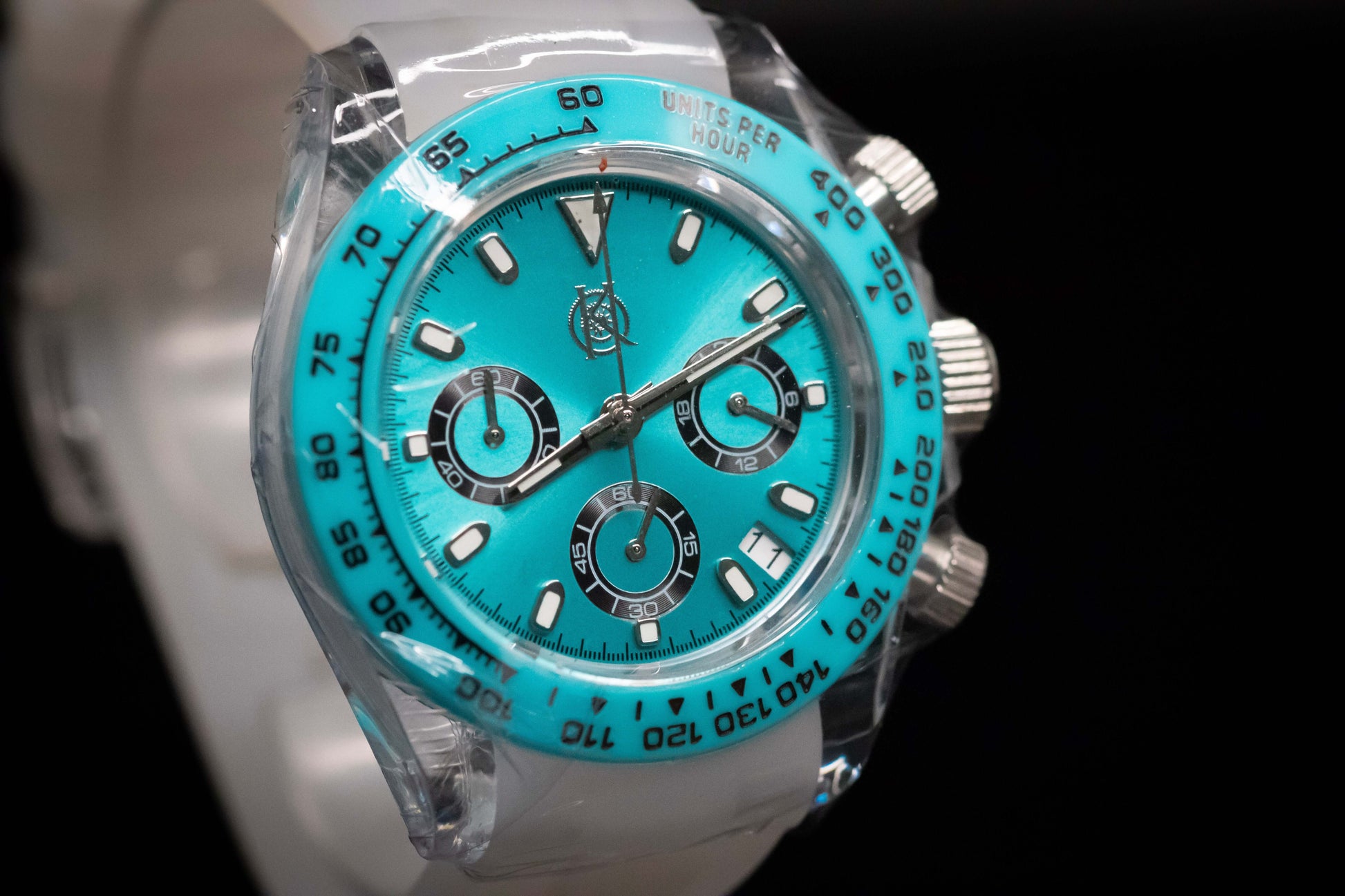 KWC Ice Ceramic Chronograph in vibrant turquoise with clear case, showcasing its precision meca-quartz features.
