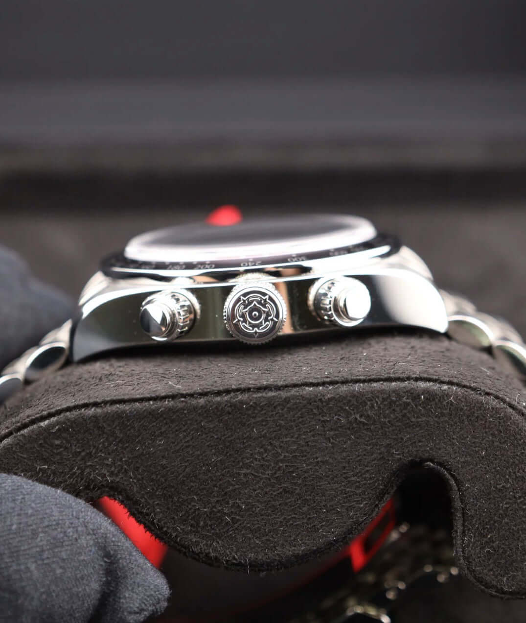 Tudor Black Bay Chrono Pink 79360N side view on display showing chronograph buttons and striking design.