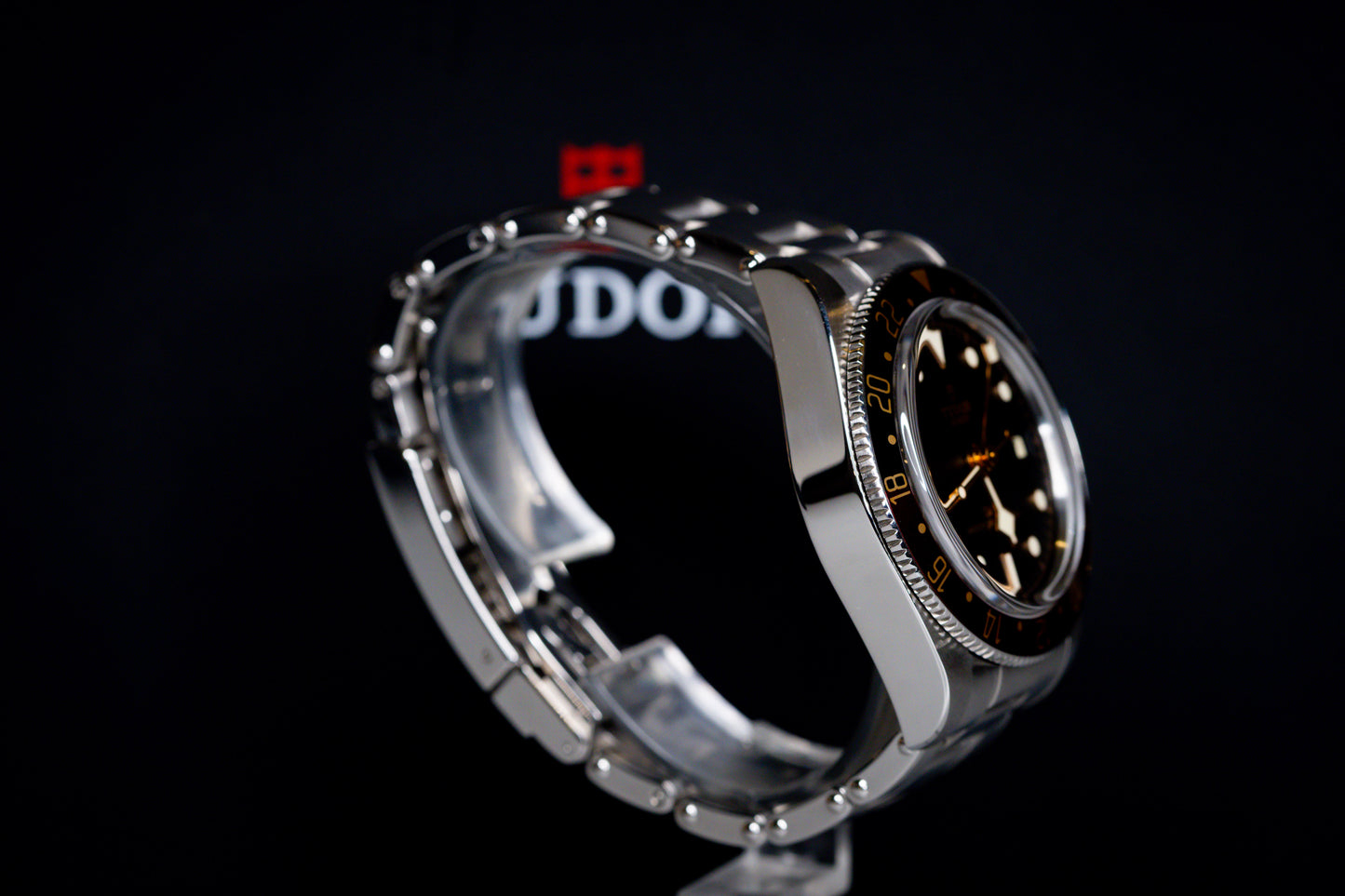 Tudor Black Bay 58 GMT Coke watch side view showcasing stainless steel case and black dial.