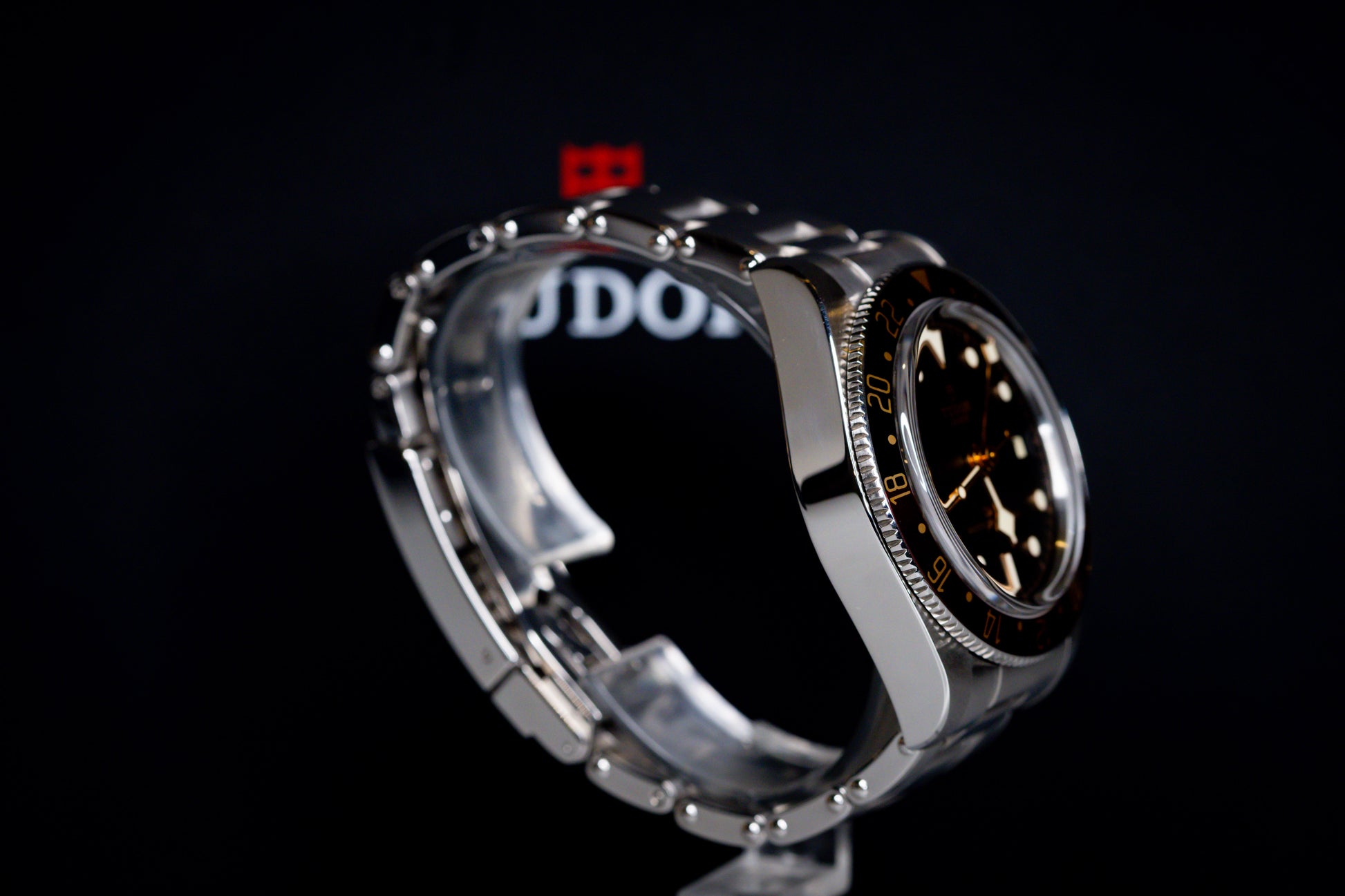 Tudor Black Bay 58 GMT Coke watch side view showcasing stainless steel case and black dial.