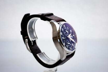 2022 IWC Pilot’s Watch Chronograph Spitfire 41mm  Ref. IW387903 | Full Set displayed on a stand.