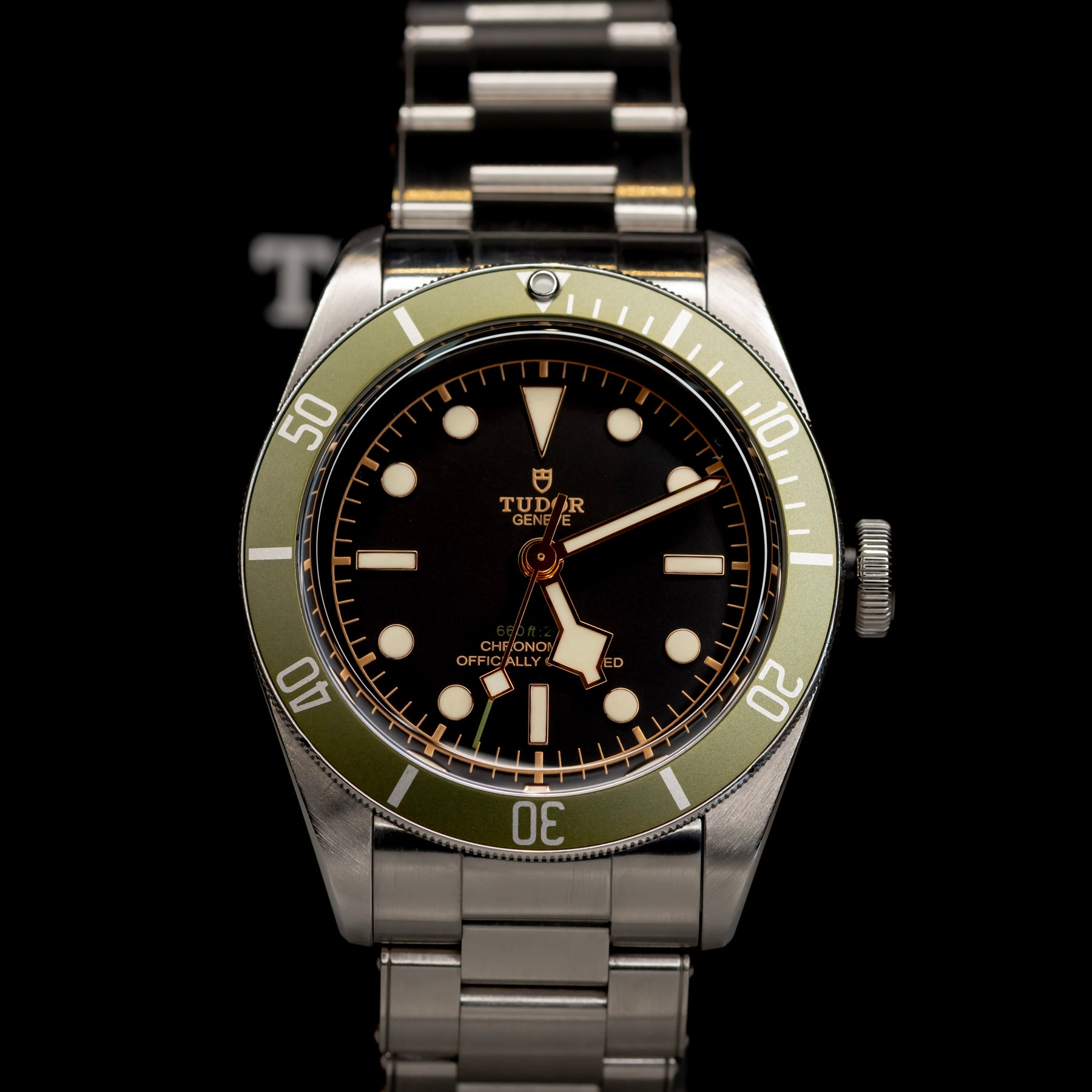 Tudor Black Bay Harrods Edition 41mm watch with green bezel and stainless steel bracelet.