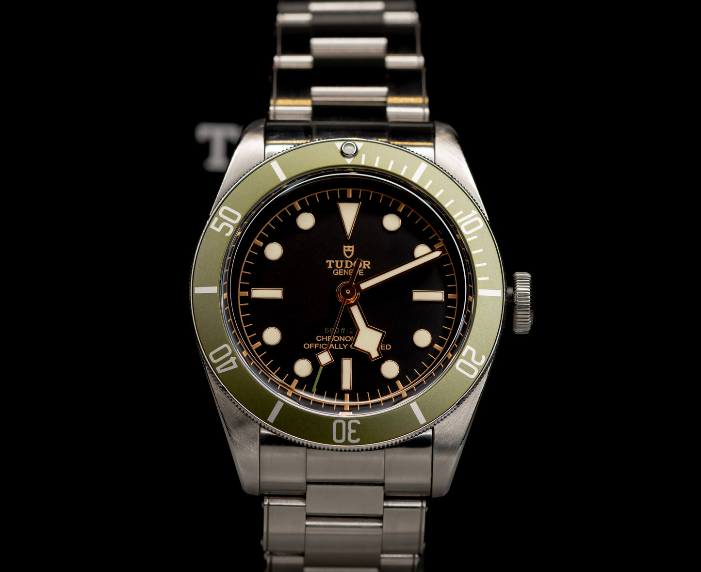 Tudor Black Bay Harrods Edition 41mm watch with green bezel and stainless steel bracelet.