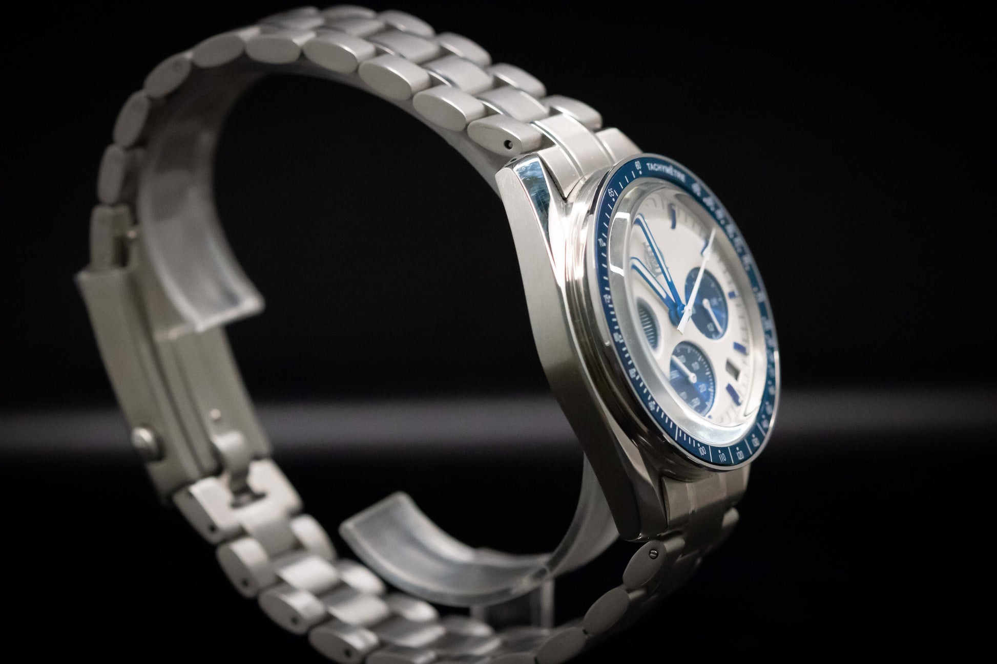 KWC Snoopy Chronograph watch with white dial and blue accents, featuring a stainless steel case and bracelet.
