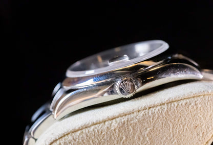 Rolex Datejust 36 full set showcasing the smooth bezel and Oystersteel case detail.