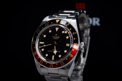 Tudor Black Bay 58 GMT Coke watch featuring a black dial and automatic movement.