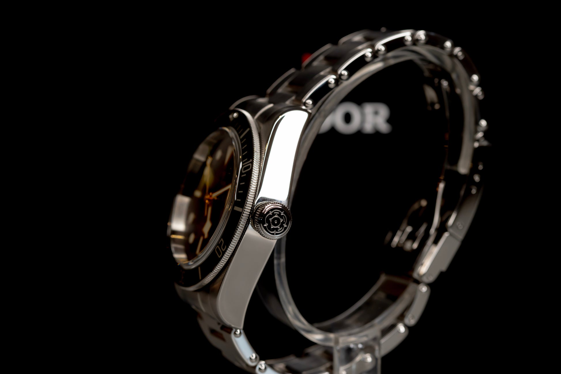 Tudor Black Bay Harrods Edition 41mm watch side view showcasing stainless steel and green bezel details.
