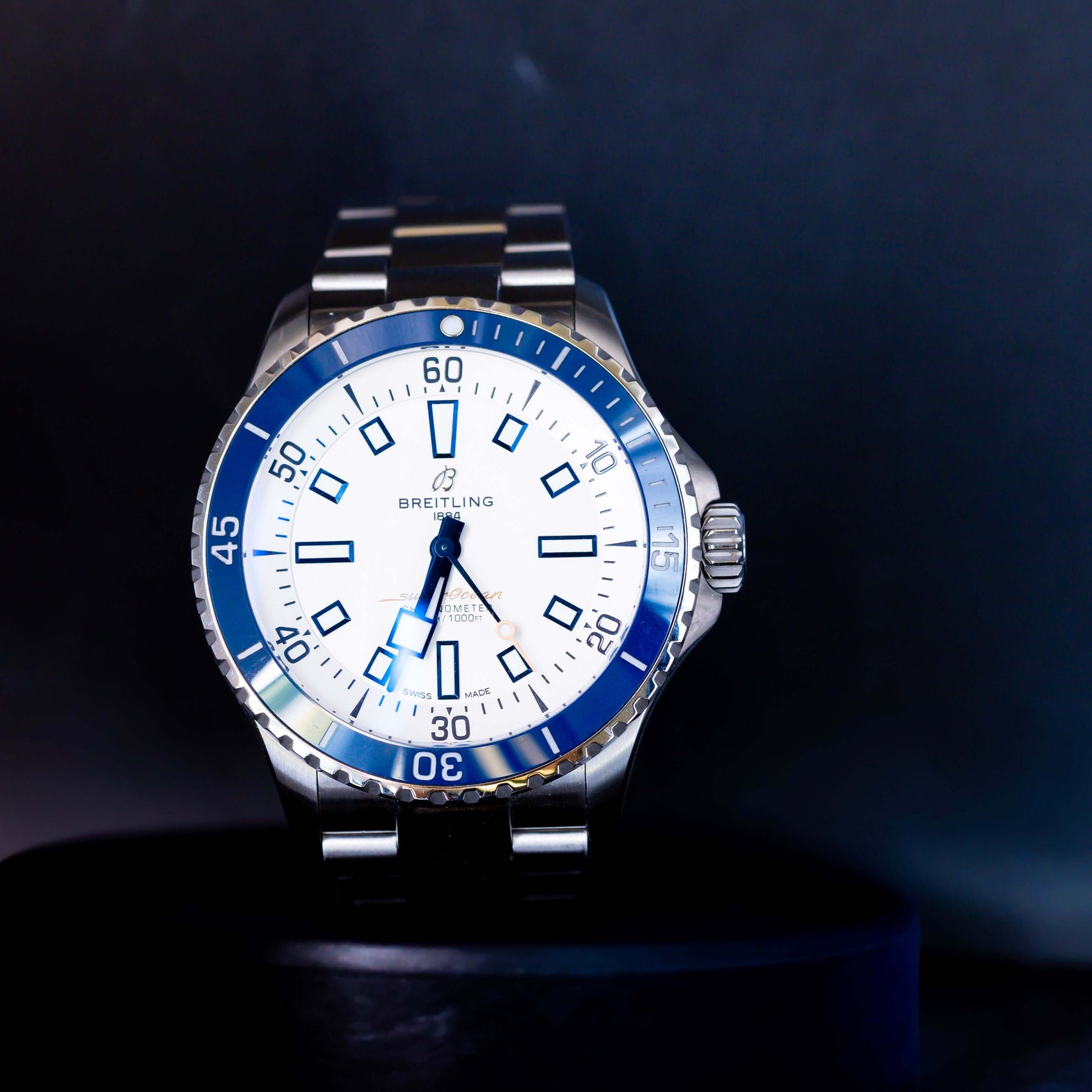Breitling Superocean Automatic 42 A17375 watch with stainless steel strap and blue bezel.