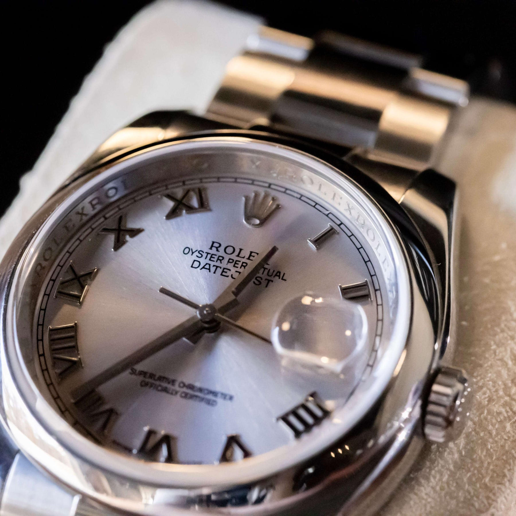 Rolex Datejust 36 full set with silver dial and Roman numerals, smooth bezel, and Oystersteel case.