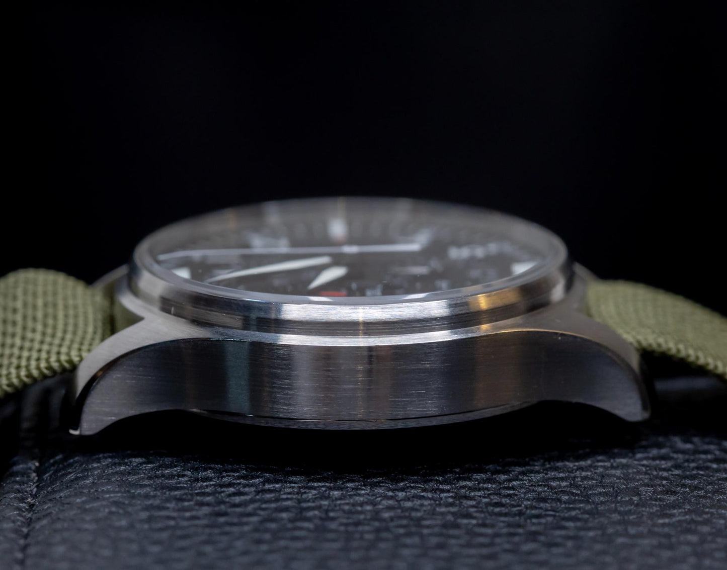 IWC Pilot's Watch Chronograph 43mm side view showcasing stainless steel case and green strap