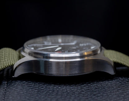 IWC Pilot's Watch Chronograph 43mm side view showcasing stainless steel case and green strap