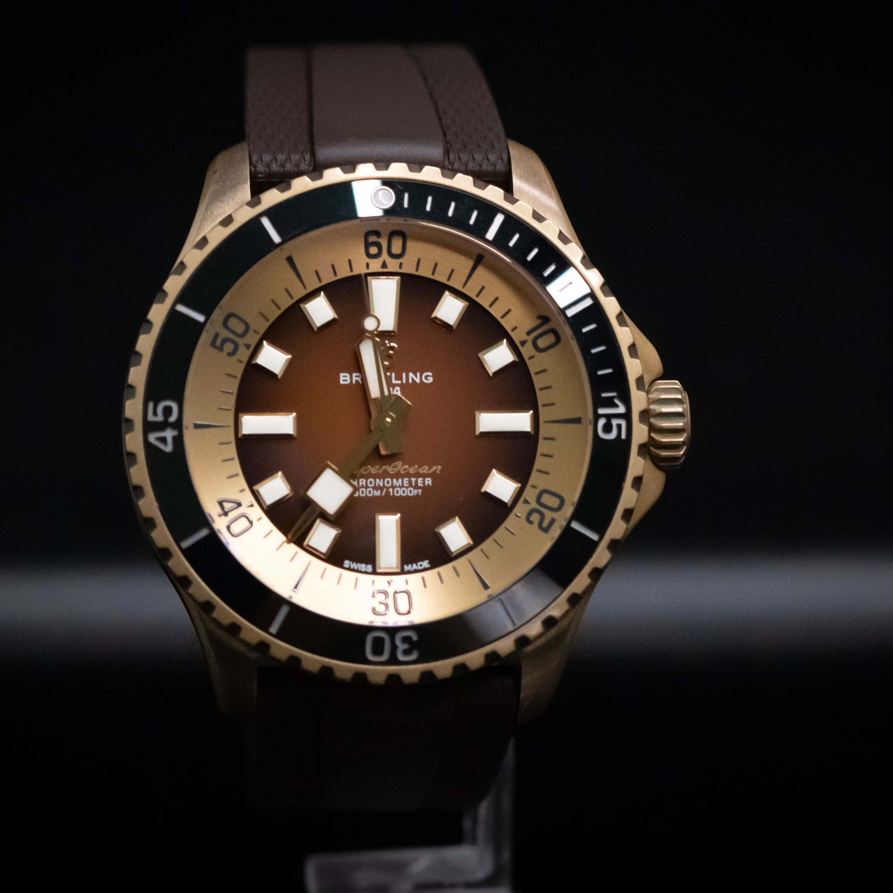 Breitling SuperOcean Automatic 44mm watch with bronze case and brown dial, showcasing bold time markers.