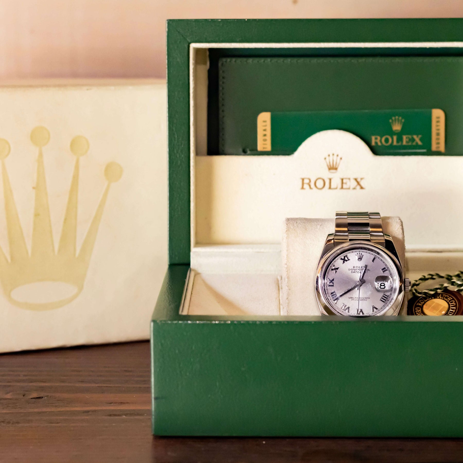 Rolex Datejust 36 full set in green box with silver dial and Roman indices.
