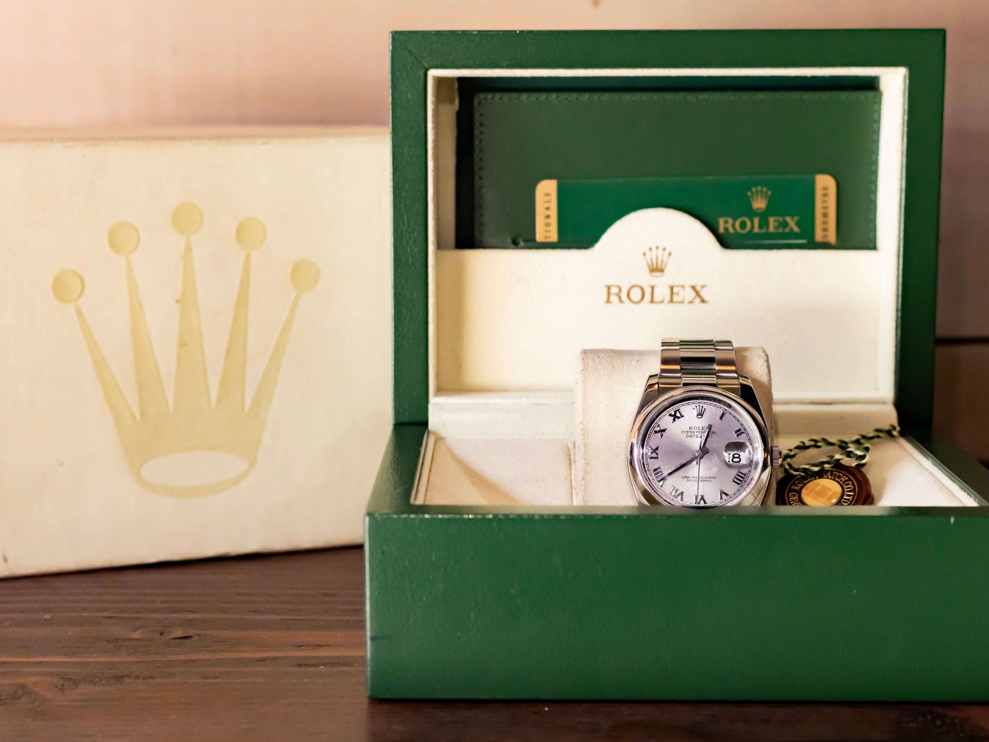 Rolex Datejust 36 full set in green box with silver dial and Roman indices.