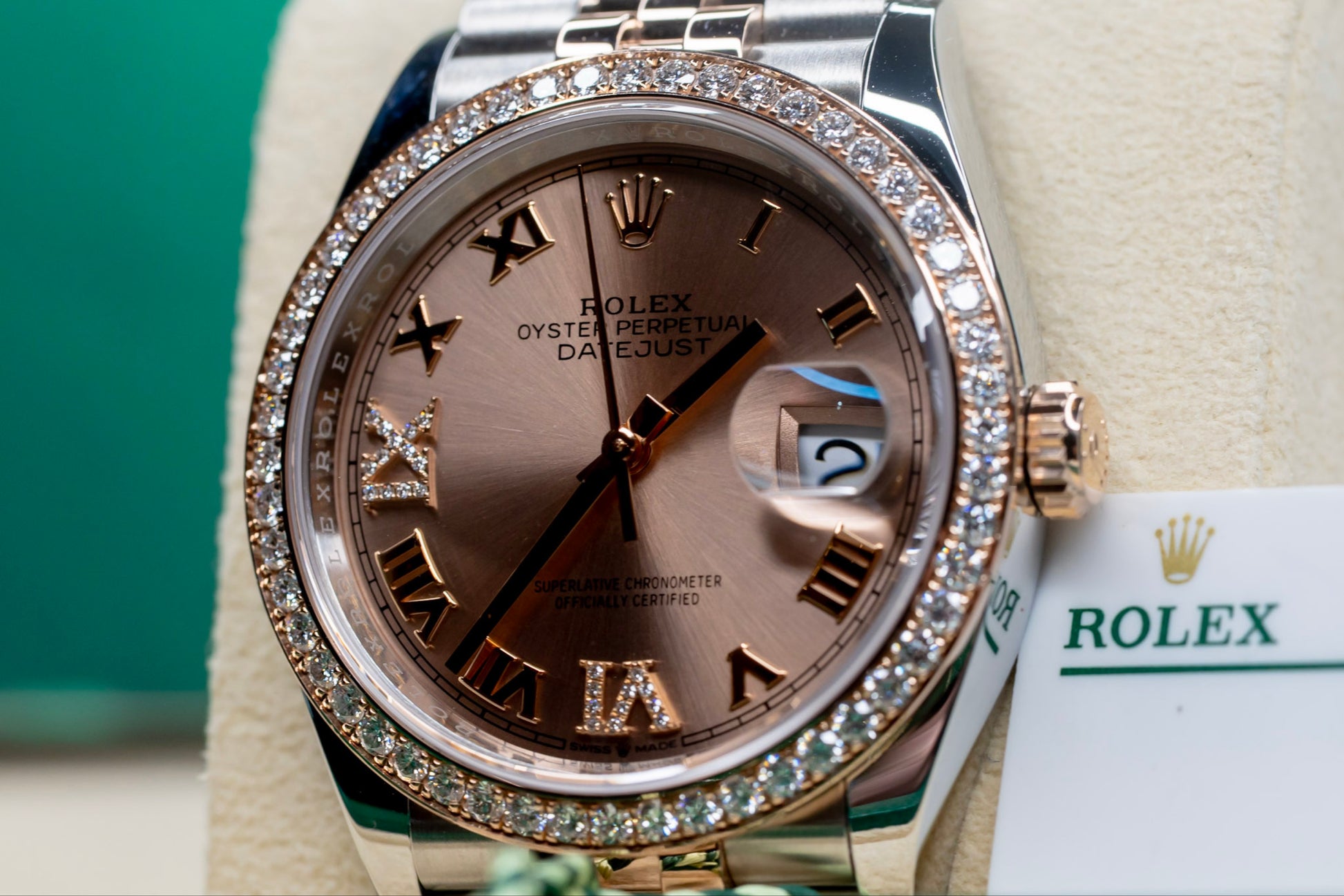 Rolex Datejust 36 watch with Everose gold and diamond accents, featuring a classic design and date window.