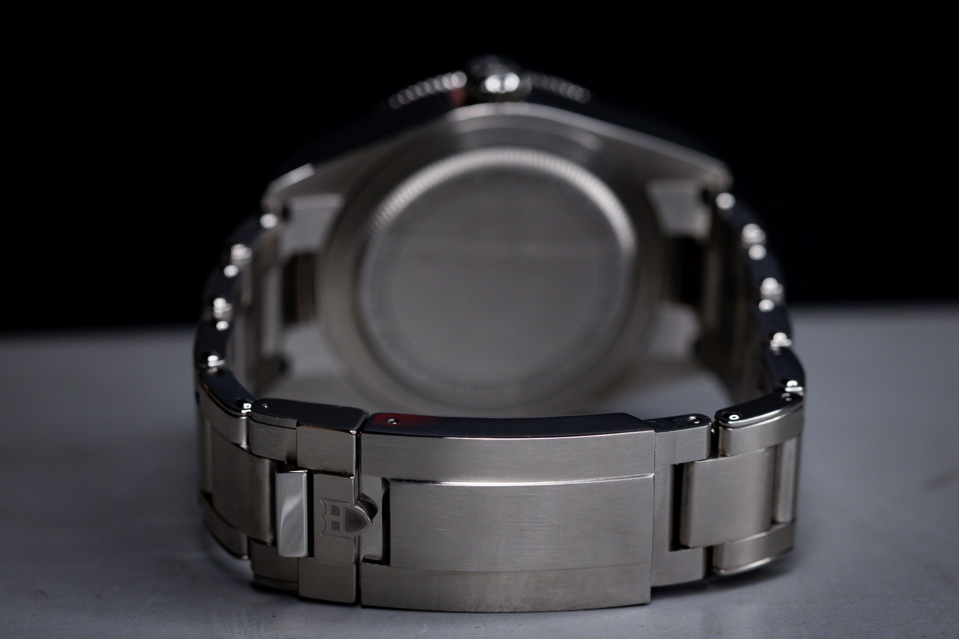 Tudor Black Bay 58 GMT Coke watch back view showing stainless steel bracelet and case details.