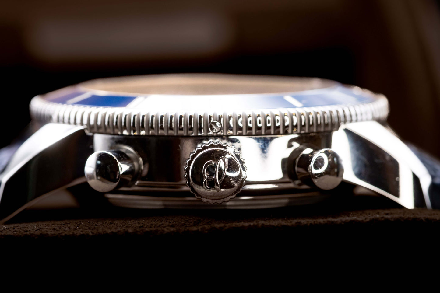 Breitling Navitimer 1 B01 Chronograph 43mm  Ref:AB0121211G1P1 close-up of watch side with detailed crown and pushers