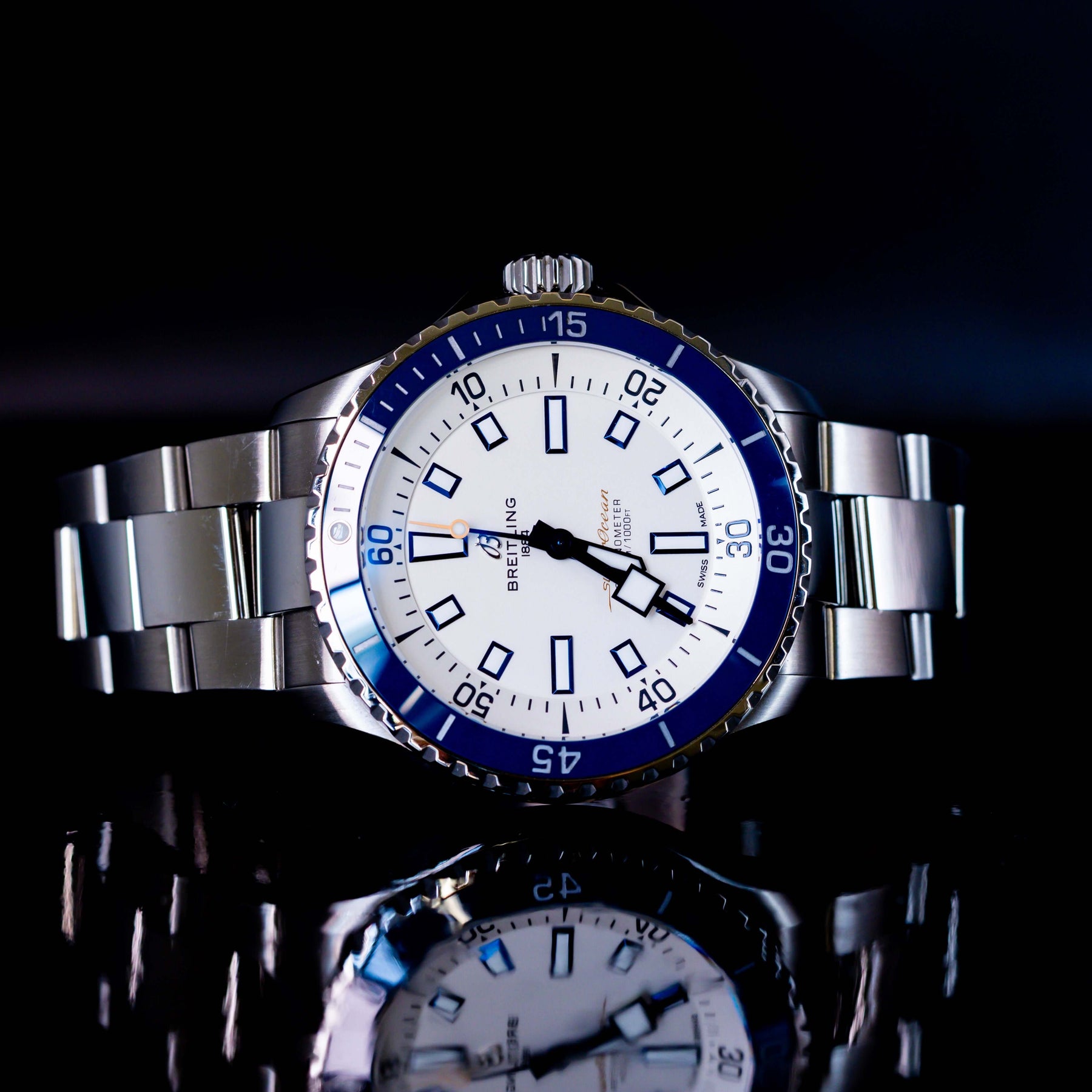 Breitling Superocean Automatic 42 A17375 in excellent condition with blue and white dial on reflective surface.