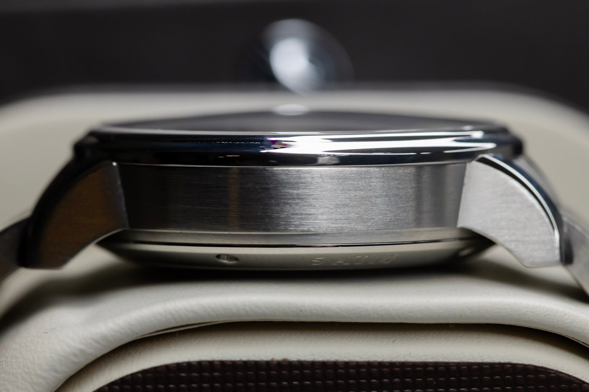 Side view of the Glashütte Original PanoMaticLunar watch showcasing its stainless steel case details.