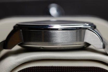 Side view of the Glashütte Original PanoMaticLunar watch showcasing its stainless steel case details.