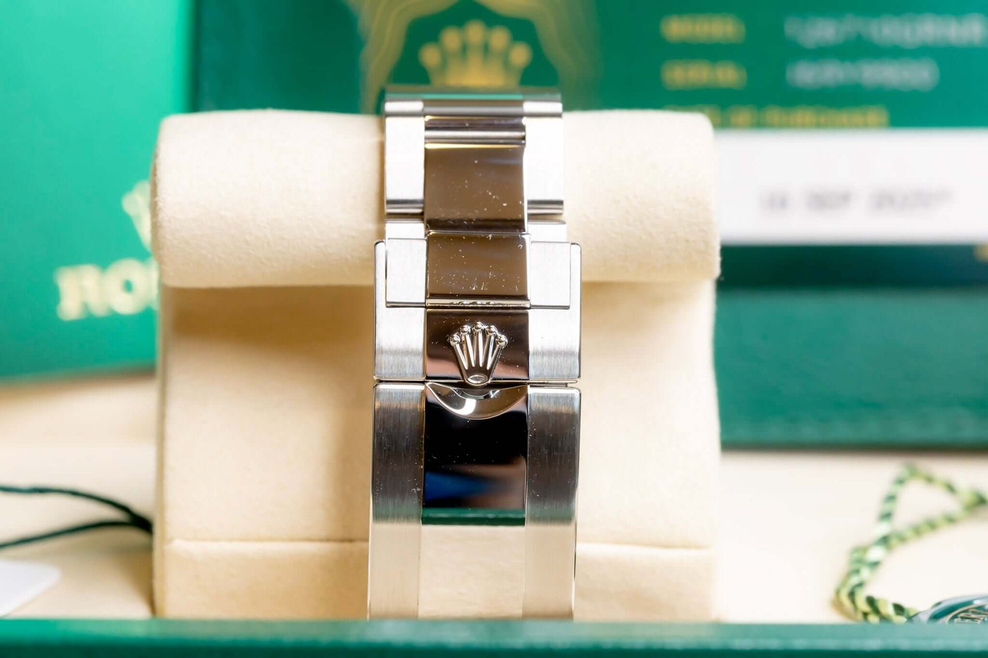 2025 Rolex GMT-Master II Bruce Wayne watch showing Jubilee bracelet on display with green Rolex packaging.