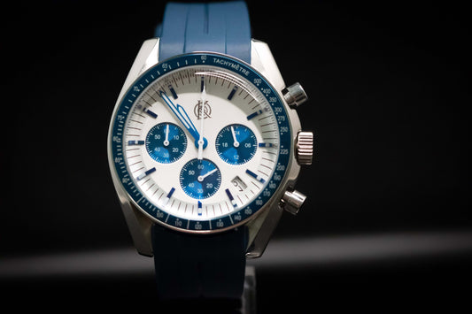 KWC Snoopy Chronograph watch with blue rubber strap, white dial, and blue subdials in stainless steel case.
