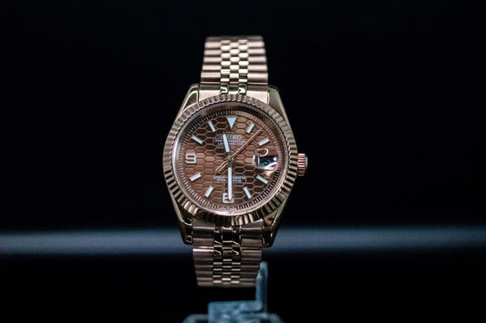 Seiko Mod Rose Gold Land Dweller watch with chocolate dial and rose gold bracelet on display.