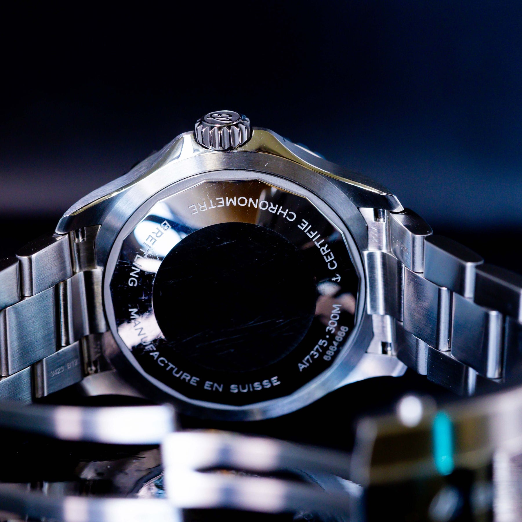 Back view of Breitling Superocean Automatic 42 watch, showcasing stainless steel bracelet and case detail.