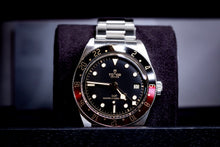 Tudor Black Bay GMT Coke watch displayed in original box, showcasing classic design and amazing condition.
