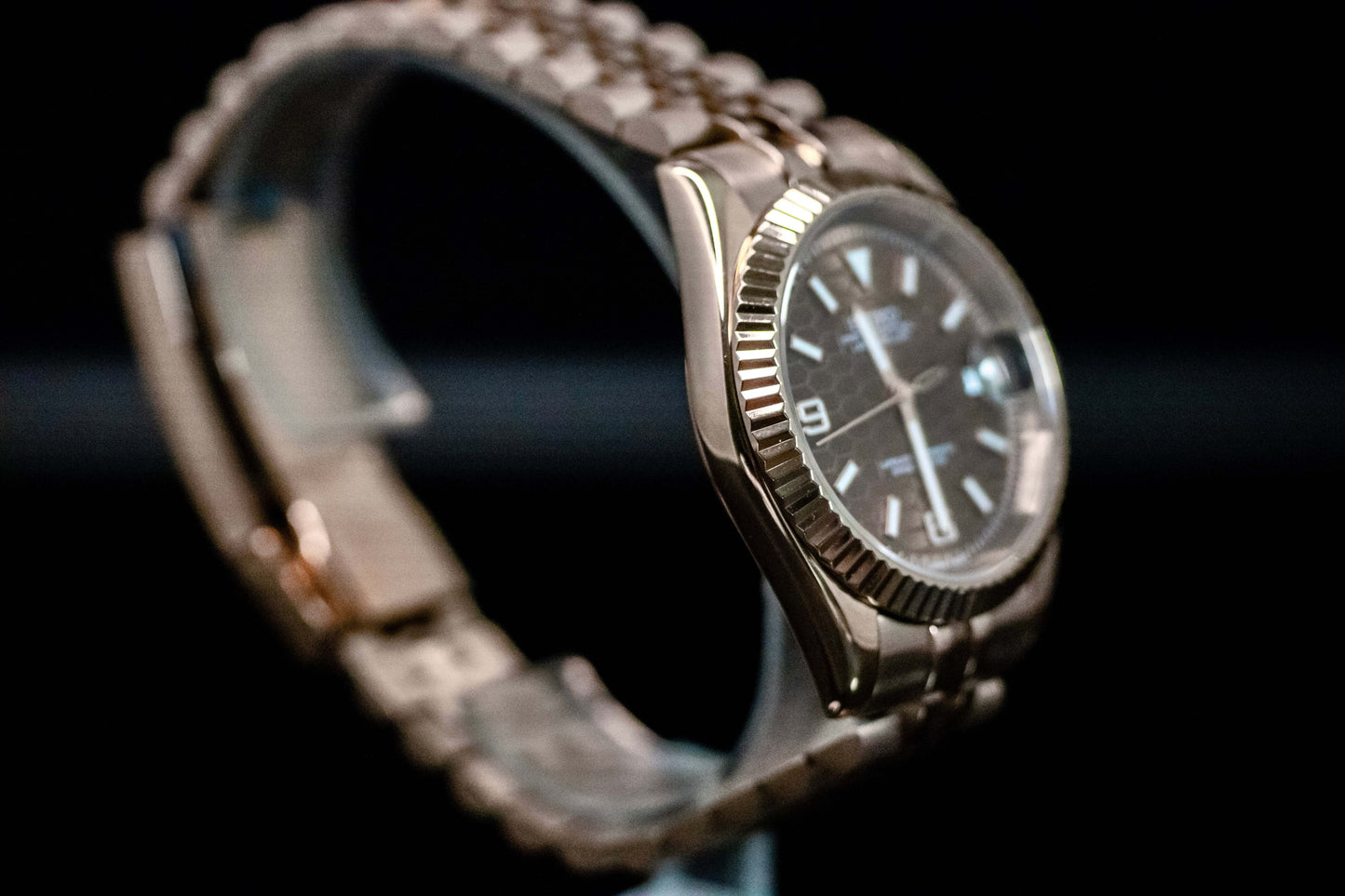 Seiko Mod Rose Gold Land Dweller watch showcasing chocolate dial and rose gold case with bracelet.
