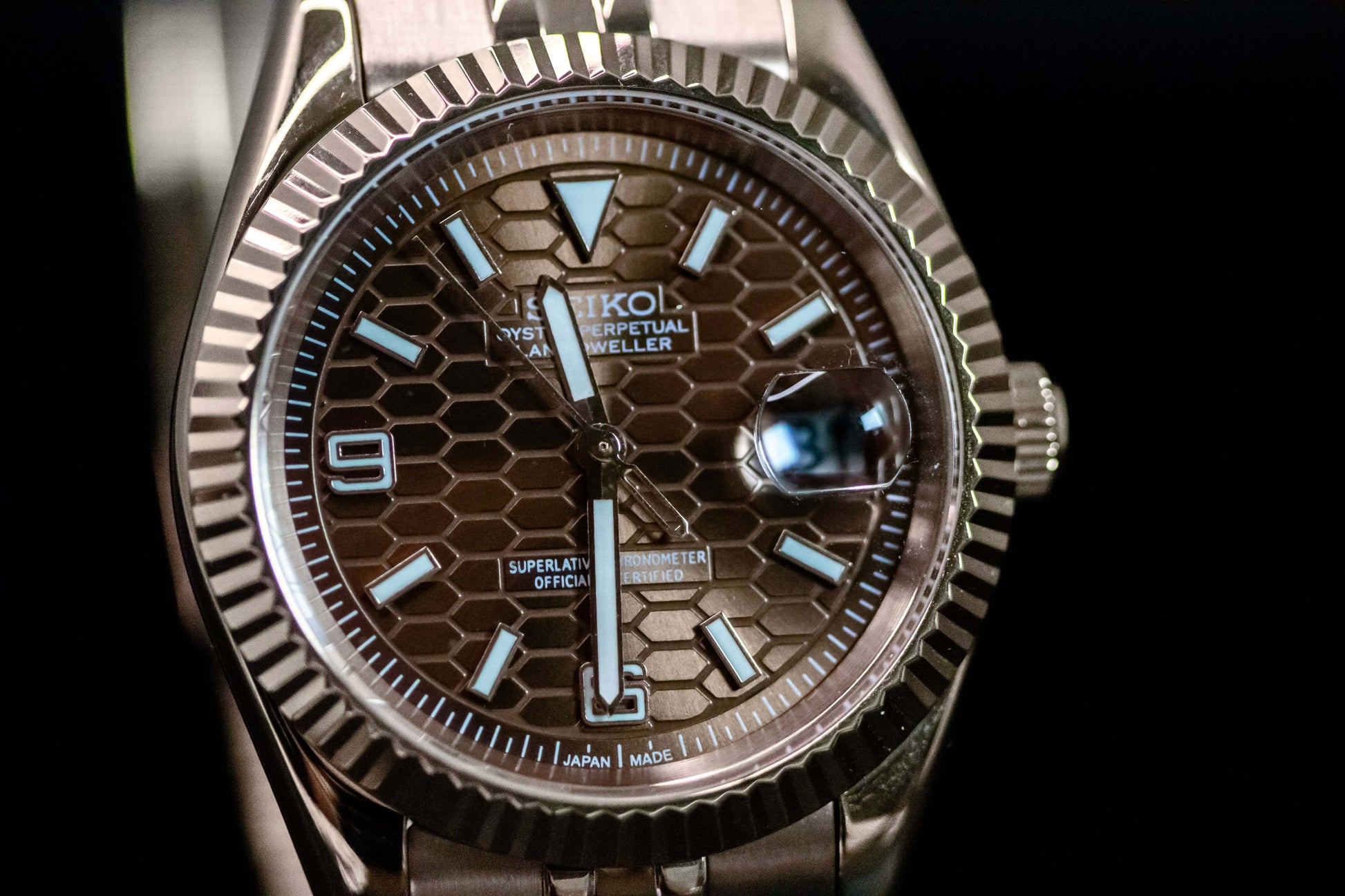 Seiko Mod Rose Gold Land Dweller watch featuring a chocolate dial and elegant design with NH36 automatic movement.